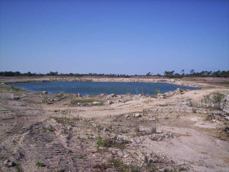 Historic site photograph showing the man-made lake and surrounding property
